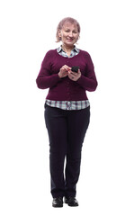 cute elderly woman reading a message on her smartphone . isolated on a white