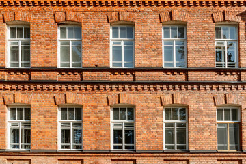 Fototapeta na wymiar Beautiful vintage red brick building at sunny day