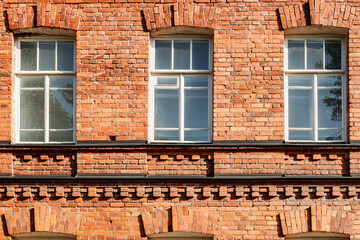 Fototapeta na wymiar Beautiful vintage red brick building at sunny day
