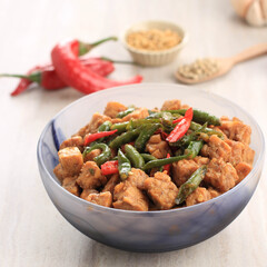 Tempe Orek or Stir Fried Tempeh, Indonesian Traditional Cuisine Made from Tempeh with Soy Sauce or Palm Sugar Added. Sometimes Add Chilli to make It Spicy