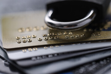 Plastic bank cards with a lock. Freeze cash and deposits concept