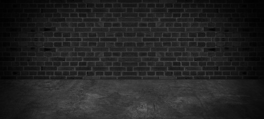 Room with black anthracite gray grey concrete floor and brick wall for interior decoration - used as background studio wall for display your products.