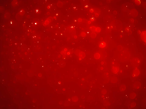 Christmas background red.Red color abstract background with soft blur bokeh light effect.