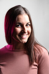 Beautiful young woman portrait, Studio shot isolated on grey background