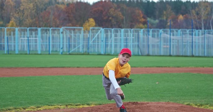 Baseball at school, the pitcher pitches fastball toward batter, boy throwing the ball, 4k 50fps.