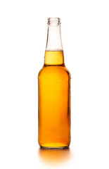 Cold full glass bottle of light craft lager with flowing drops, isolated on white background