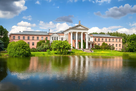 Main Botanical Garden Of The Moscow. Classical building with columns reflecting in Botanical Pond