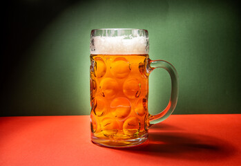 beer mug on green and red background, christmas