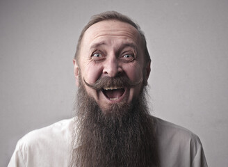 man with astonished expression with long beard