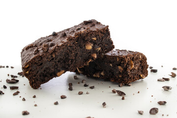 Brownie pieces on white background. Delicious chocolate pie.