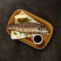 Grilled seabass with narsharab sauce top view