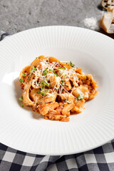 Pappardelle pasta with salmon and sauce bisque