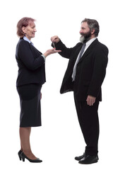 businessman handing keys to a business lady . isolated on a white