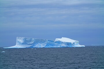 Fototapeta na wymiar This iceberg looks very much like a submarine. 