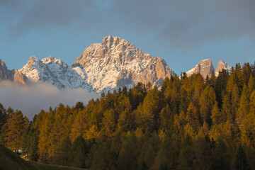 A sunset in Olomiti with white peaks