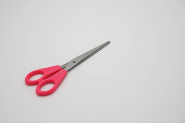 Beautiful pink scissors, ready for use.