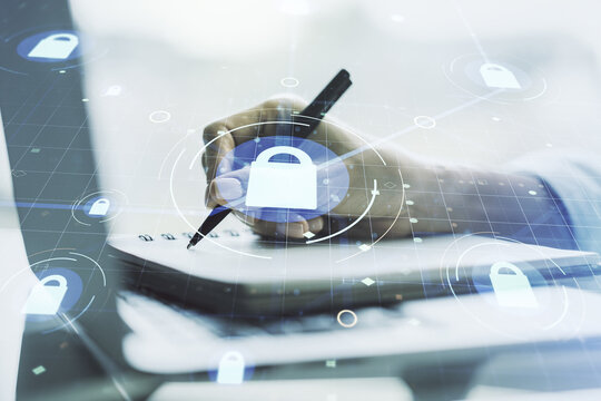 Creative lock sketch with chip hologram and hand writing in notepad on background with laptop, protection of personal data concept. Multiexposure