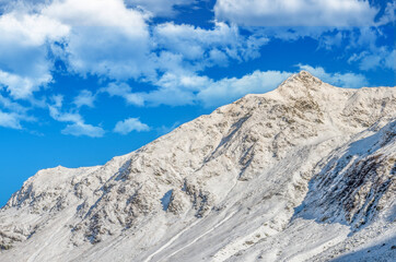 Stunning view of Fagaras mountains in winter. The ridge of the mountain full of snow. There are one of the beautiful road in the world, Transfagarasan