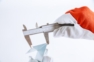 precise measurement of metal parts on a white background using a vernier caliper