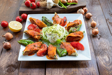 traditional turkish beyti kebab. served on a plate with salad and rice