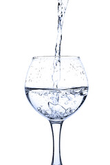 Wine glass with splashes of fresh water drops 