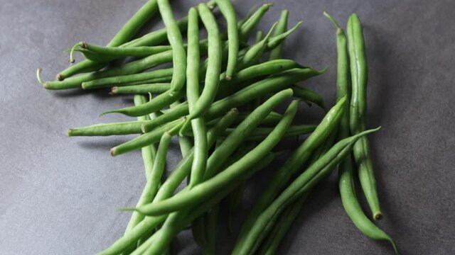 fresh green beans on a gray base