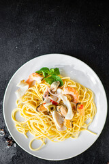 pasta seafood spaghetti shrimp, mussels and more second course healthy meal snack top view copy space for text food background