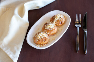 Turkish Kemalpasa Cheese Dessert / Lor Tatlisi with Pistachio Powder and Sherbet. Traditional Dessert
