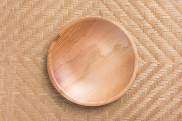 Betel palm leaf plate (Biodegradable, Compostable or Eco friendly disposable plate) on woven bamboo sheet