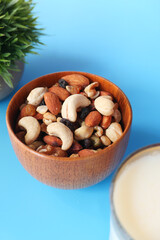 close up of many mixed nuts in a bowl 