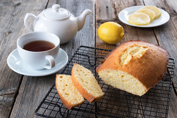 Fototapeta na wymiar Lemon cake with Lemon is a well-known classic pastry and dessert in American cuisine.