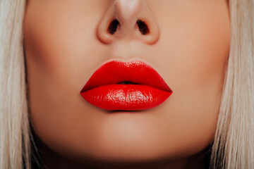 Beauty. Red Lips Close-up. Lip Makeup. Beautiful red Lipstick on women's lips 