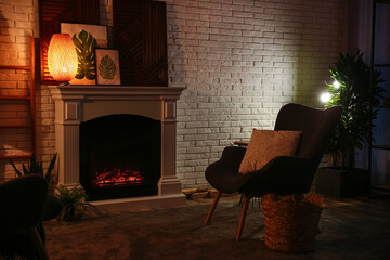 Living room interior with decorative fireplace near white brick wall