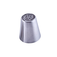 Stainless steel piping nozzle isolated on white background, copy space. Icing tip for decorating cakes and cookies. Frosting nozzle, icing