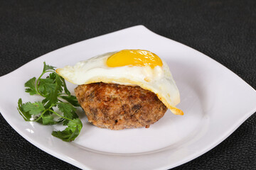 Beef cutlet with egg and coriander