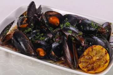 Tasty delicous boiled Mussels with herbs