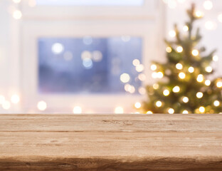 Desk space in front of defocused window with christmas tree