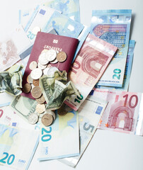 Cash on table isolated: dollars, euro, rubl broken money. All in mess, global crisis . passport travel concept