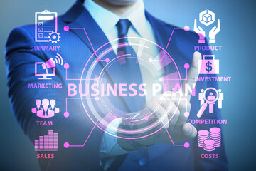 Business plan concept with businessman pressing button