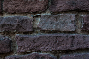 old brick wall texture. brown brick wall background. Fragment of the old brick fortress wall. Architecture, fortification, exterior