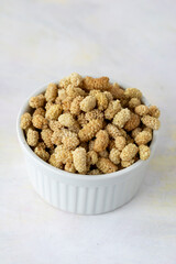 dried mulberry on wooden background