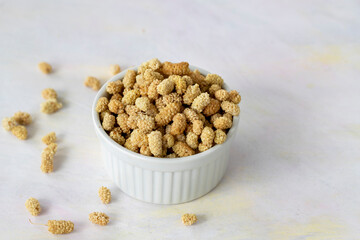 dried mulberry on wooden background