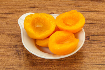 Marinated peaches fruit in the bowl