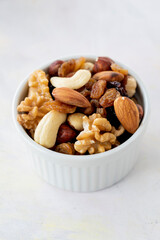 mixed nuts in bowl - on white background