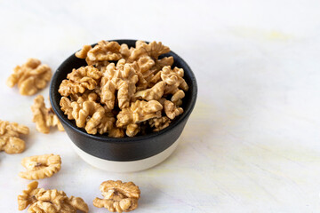 walnuts in bowl - on wooden background