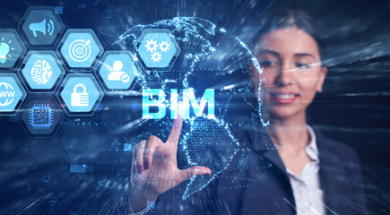 The concept of business, technology, the Internet and the network. A young entrepreneur working on a virtual screen of the future and sees the inscription: BIM
