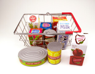 Izmir, Turkey, 11-23-2020, food items with generic labels in shopping basket on white background