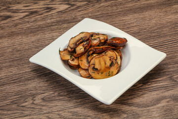 Roasted champignon with herbs and spices
