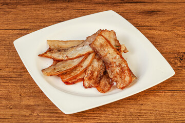 Roasted juicy bacon in the plate