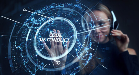 Business, Technology, Internet and network concept. Young businessman working on a virtual screen of the future and sees the inscription: Code of conduct